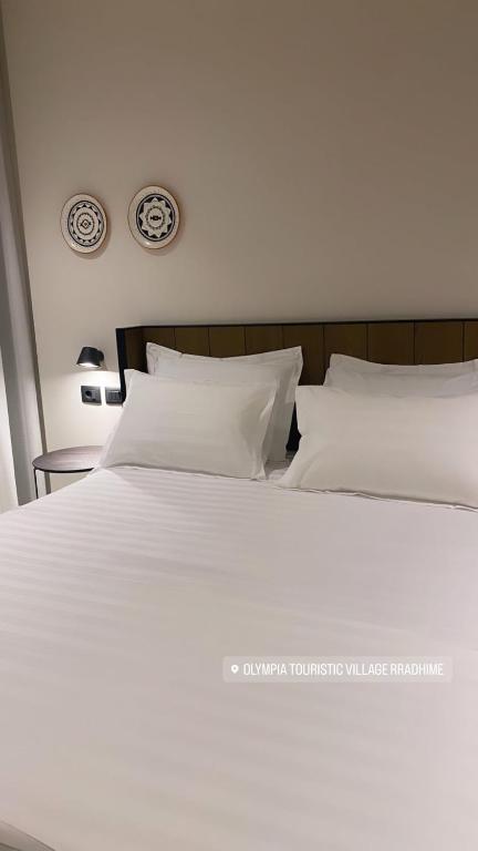 Postel nebo postele na pokoji v ubytování Hotel Olympia Touristic Village