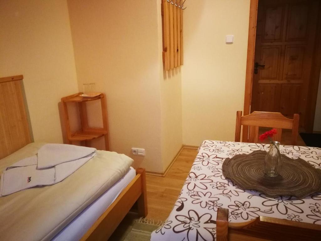 Postel nebo postele na pokoji v ubytování Pod palmou Gerlachov