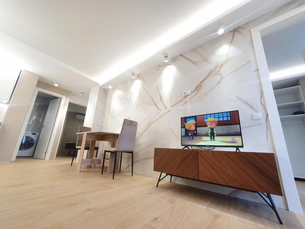 TV a/nebo společenská místnost v ubytování SALOU ,APARTAMENTO CON PISCINA y Wifi