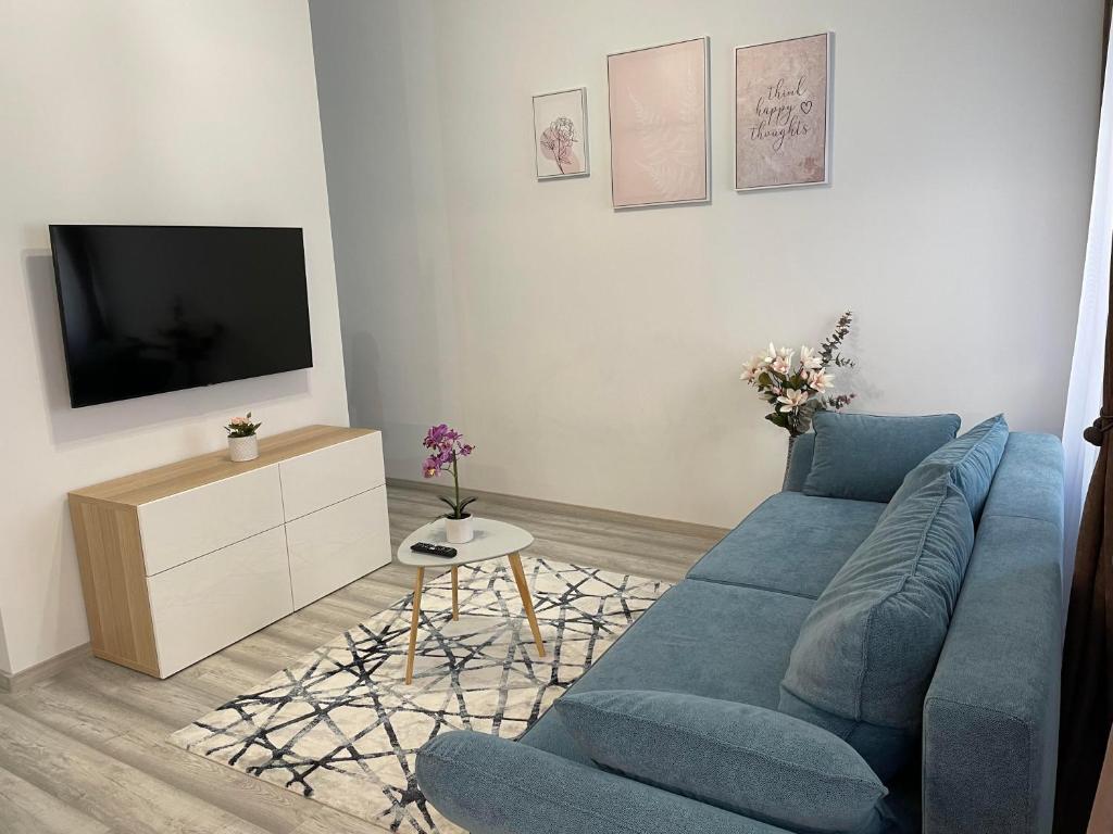 TV a/nebo společenská místnost v ubytování Eden City Home