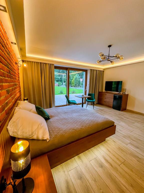 Postel nebo postele na pokoji v ubytování Domek pod Katalpami
