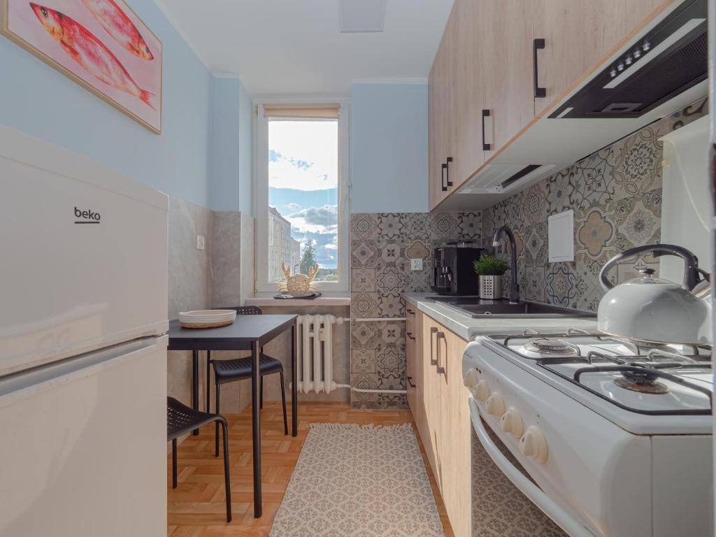 Kuchyňa alebo kuchynka v ubytovaní Apartament nad Małym Jeziorakiem