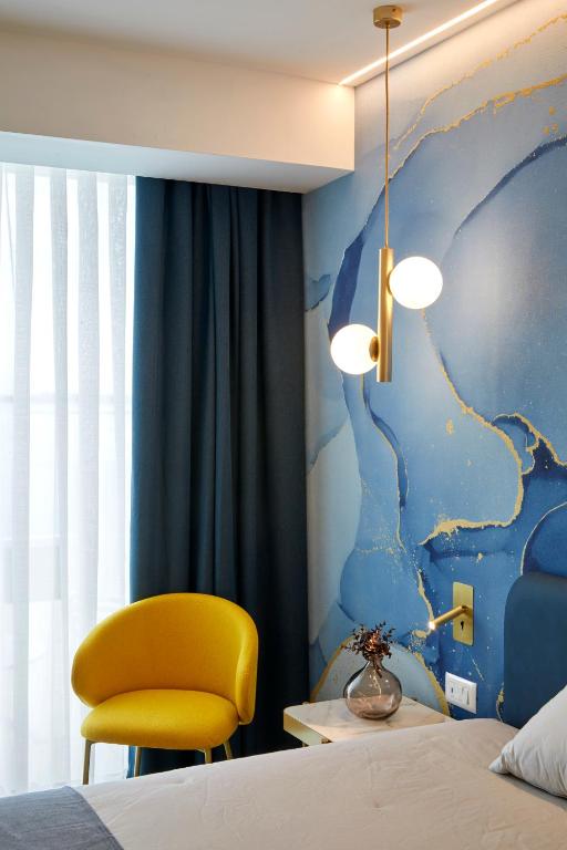Postel nebo postele na pokoji v ubytování Riva Palace Hotel