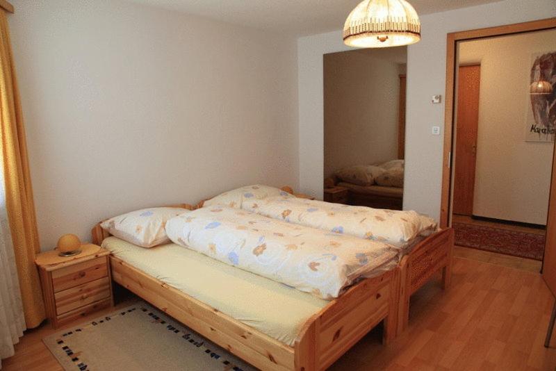 Postel nebo postele na pokoji v ubytování Hotel Guidon Apartments