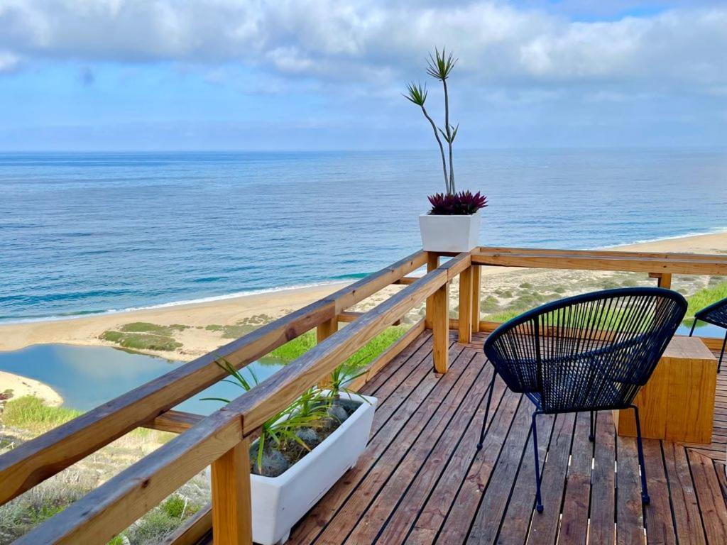 a wooden deck with a view of the ocean at Villas La Mar - Adults 15 plus in Todos Santos