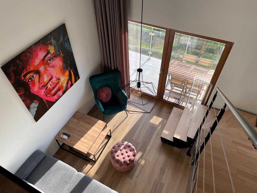 an overhead view of a living room with a painting at Royal Blue Port in Rowy