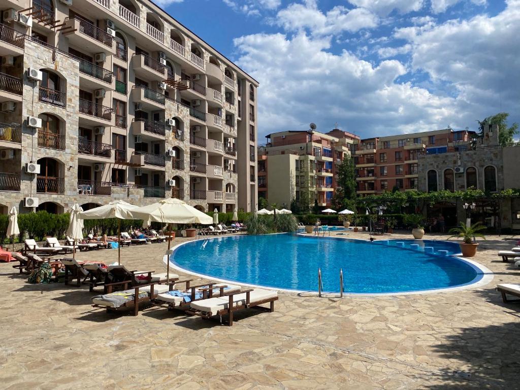 a large swimming pool in the middle of a building at KALIA A16 Private One Bedroom Apartment in Sunny Beach