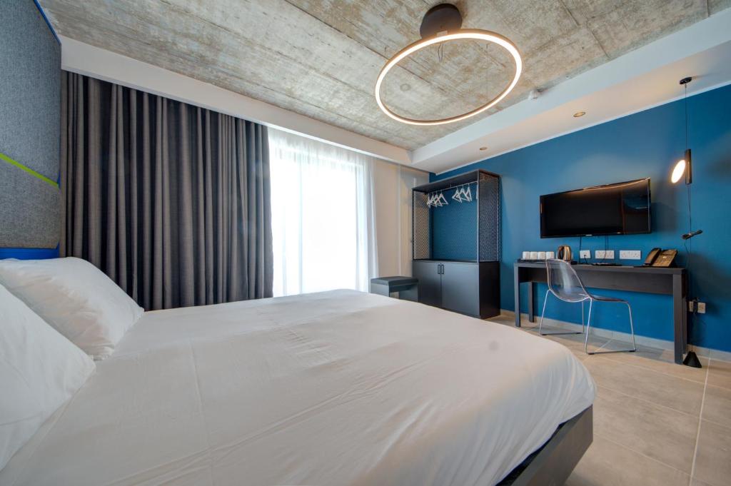 Postel nebo postele na pokoji v ubytování IKYK Hotel- IK Collection