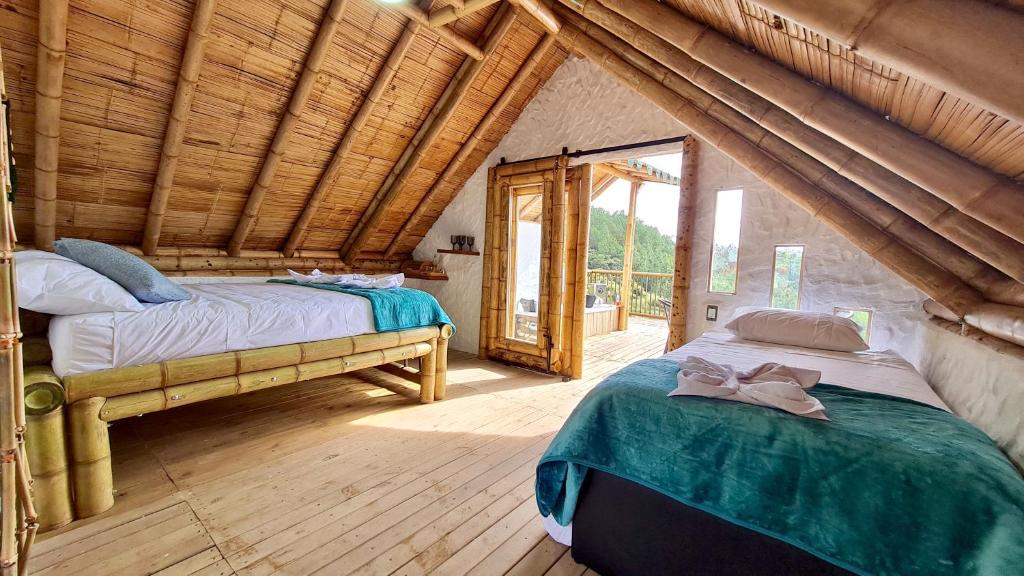 Voodi või voodid majutusasutuse Hass Glamping Jericó toas