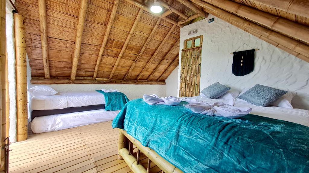 Voodi või voodid majutusasutuse Hass Glamping Jericó toas