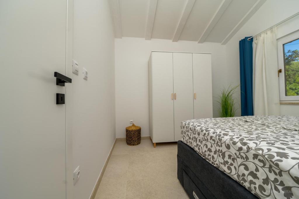 Postel nebo postele na pokoji v ubytování STONE HOUSE LEANI
