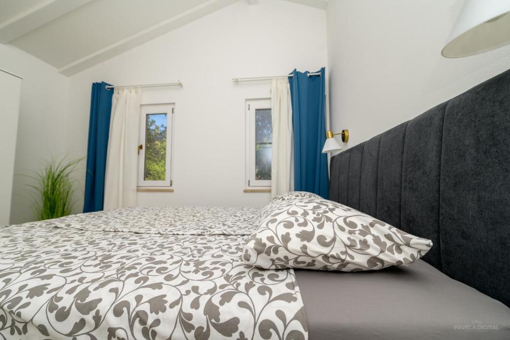 Postel nebo postele na pokoji v ubytování STONE HOUSE LEANI