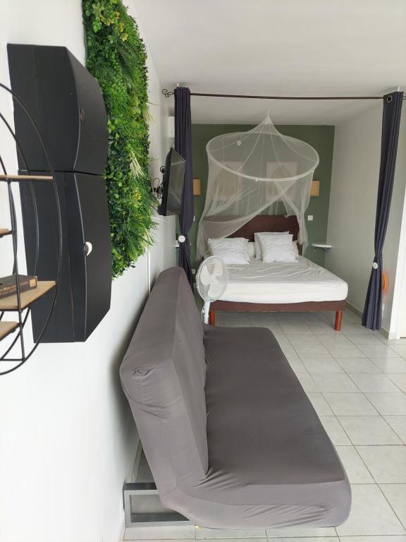 Postel nebo postele na pokoji v ubytování Ti kay dous - Mer des Caraïbes & piscine