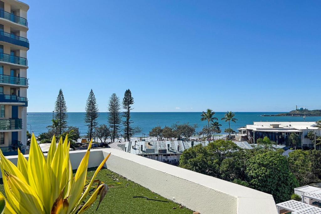a view of the ocean from the balcony of a building at Caribbean 66 in Mooloolaba