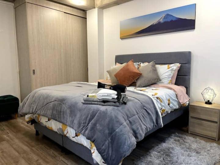Cama o camas de una habitación en 501 Arena Suites Movistar