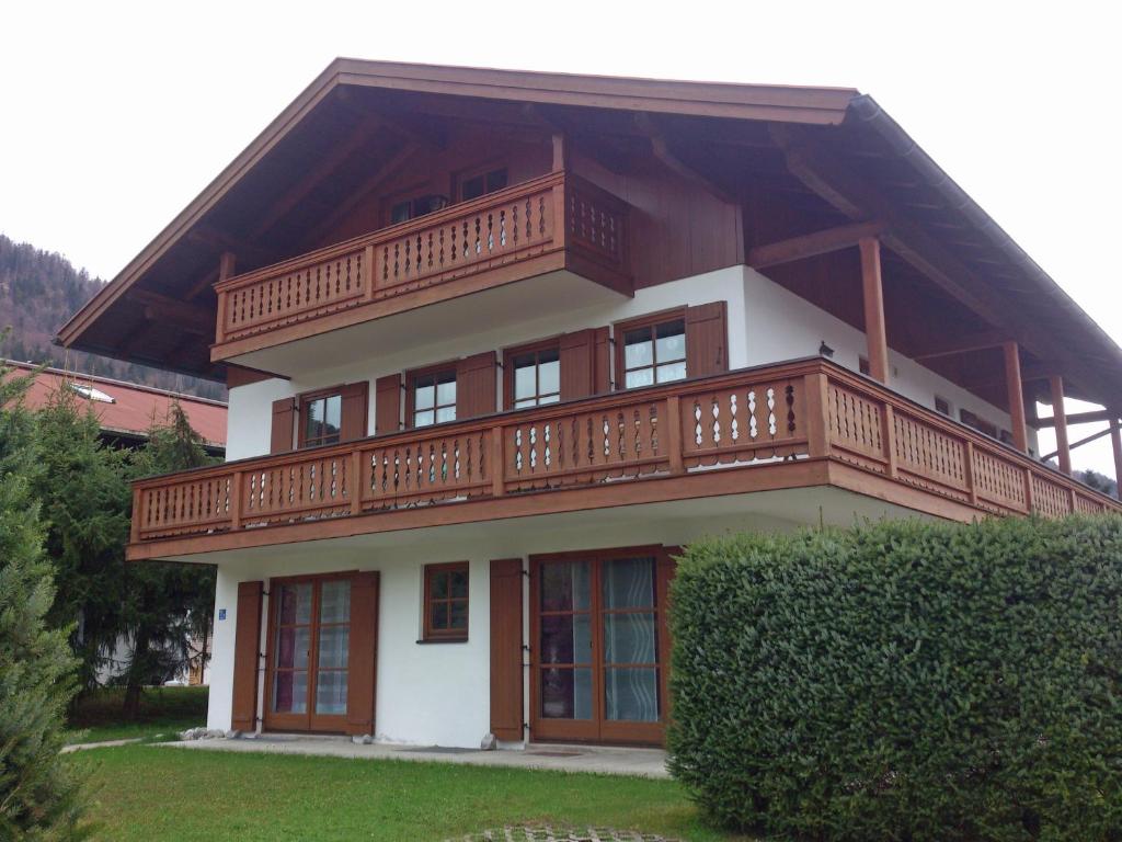 a large house with a balcony on top of it at BIENE`S Ferientraum in Reit im Winkl