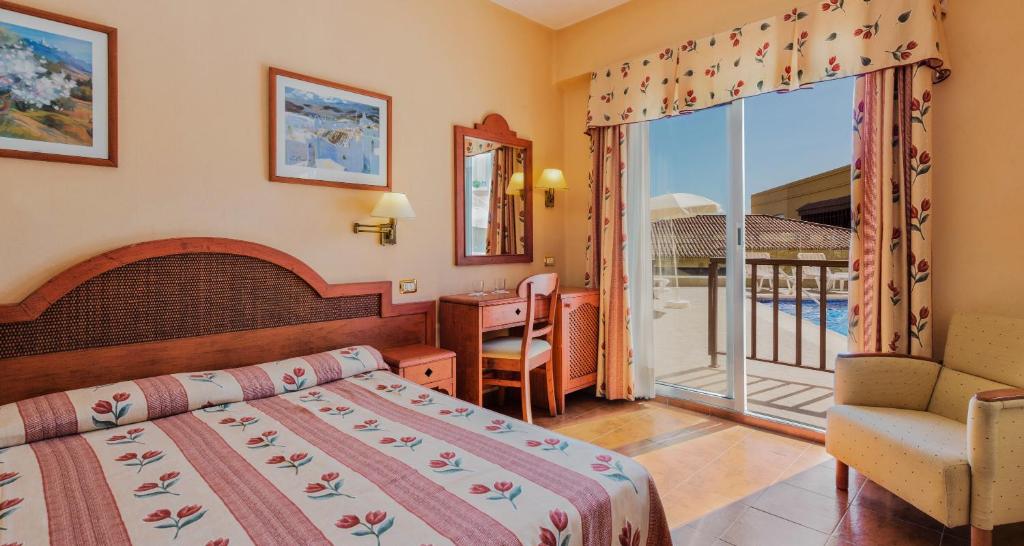Postel nebo postele na pokoji v ubytování Hotel Monopol
