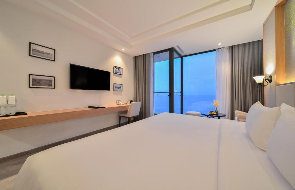 Postel nebo postele na pokoji v ubytování Navada Beach Hotel