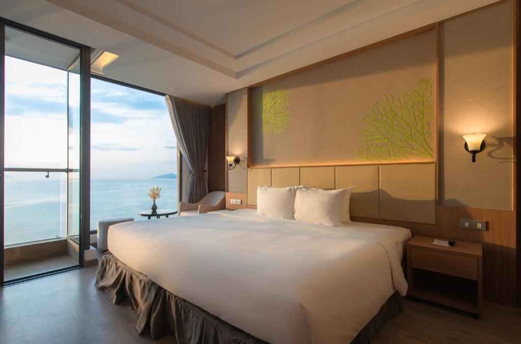 Giường trong phòng chung tại Navada Beach Hotel
