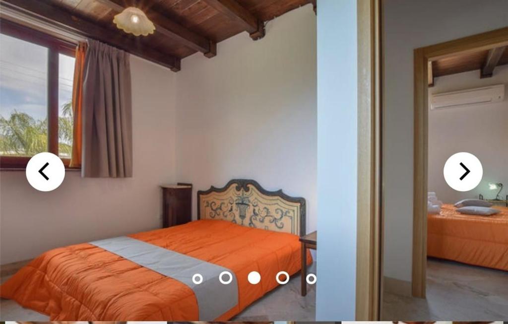 - une chambre avec un lit orange et une fenêtre dans l'établissement Les barriques appartament, à Gaggi