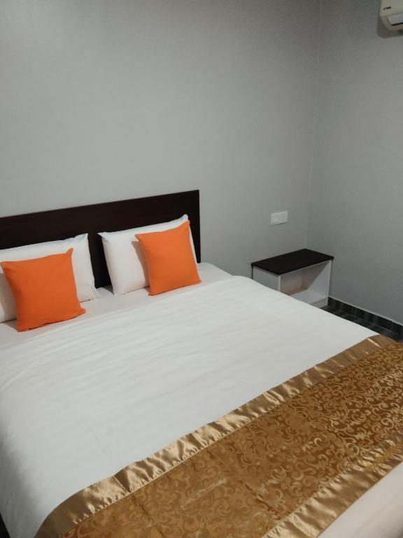 Postel nebo postele na pokoji v ubytování One World Hotel