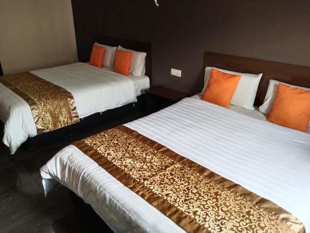 Postel nebo postele na pokoji v ubytování One World Hotel