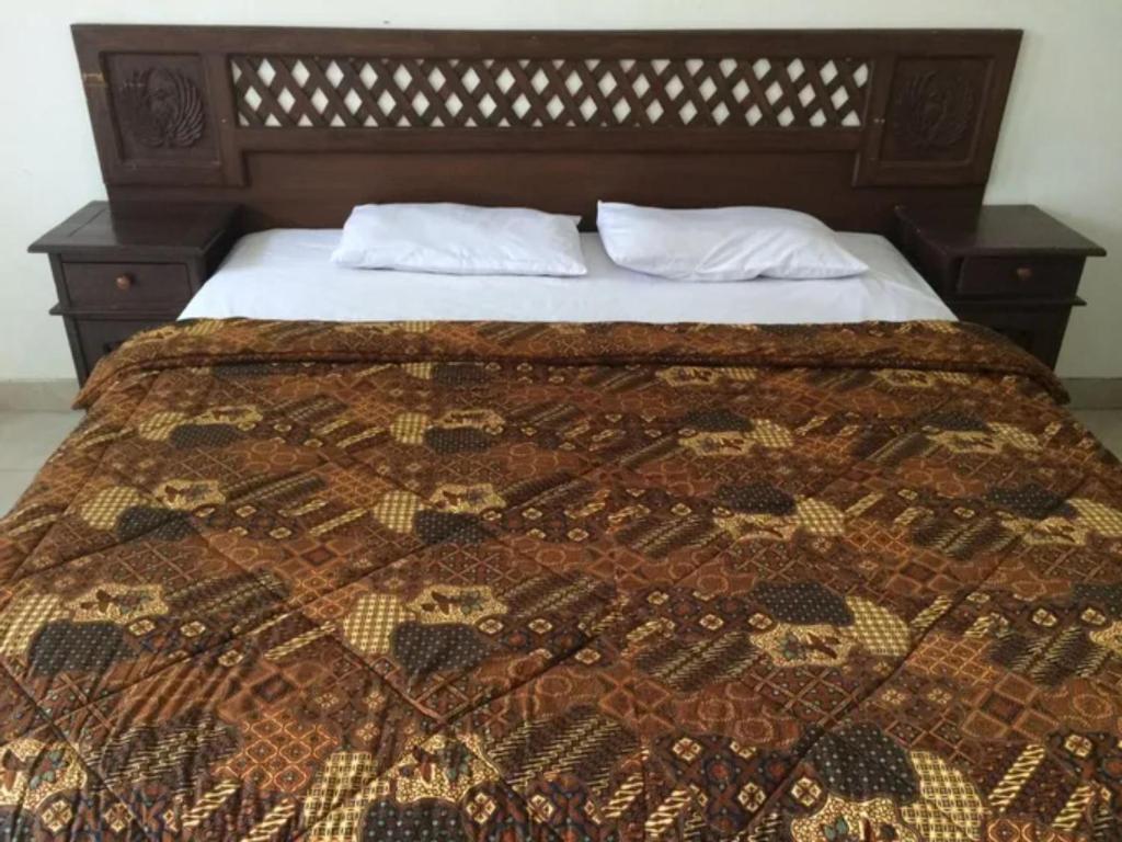 Postel nebo postele na pokoji v ubytování Hotel Laweyan Solo
