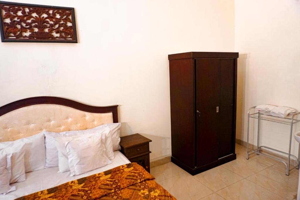 Postel nebo postele na pokoji v ubytování Hotel Laweyan Solo