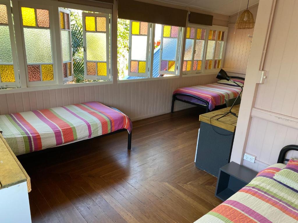 Postel nebo postele na pokoji v ubytování Dreamtime Hostel