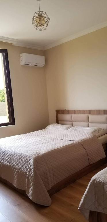 Postel nebo postele na pokoji v ubytování Mate's GUEST HOUSE