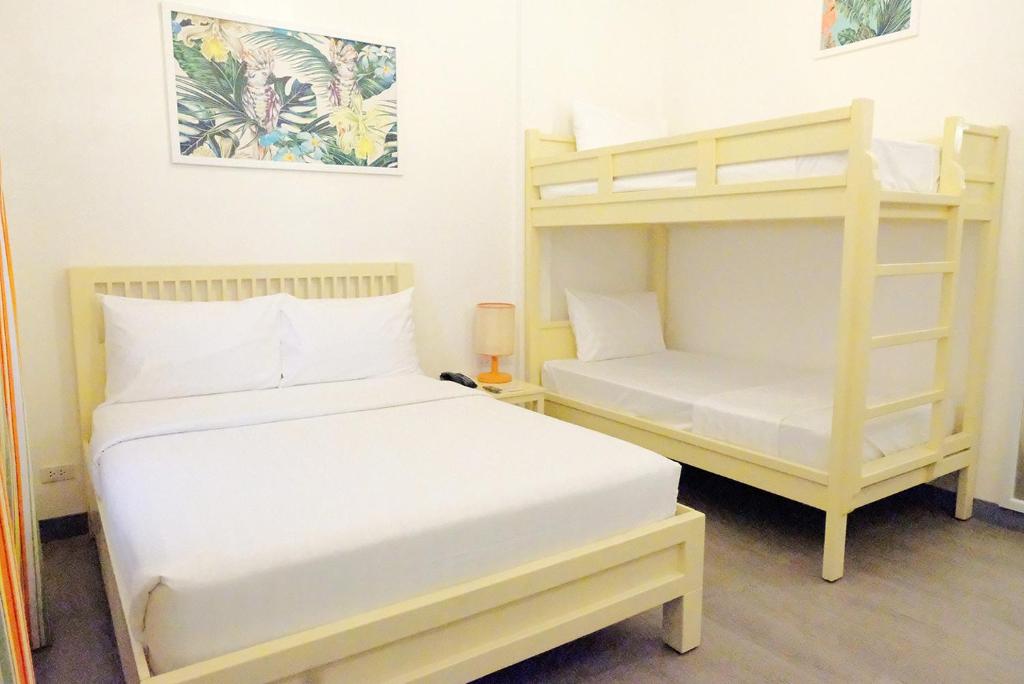 Postel nebo postele na pokoji v ubytování Maayo San Remigio