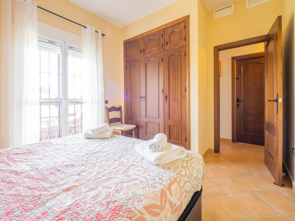 Łóżko lub łóżka w pokoju w obiekcie Cubo's Villa Teresa