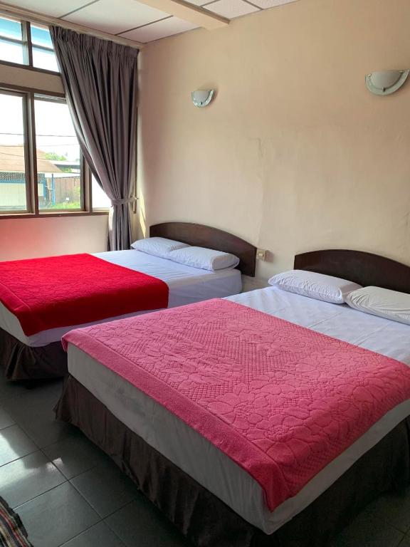 Postel nebo postele na pokoji v ubytování HOTEL MIRAMA 美麗華酒店