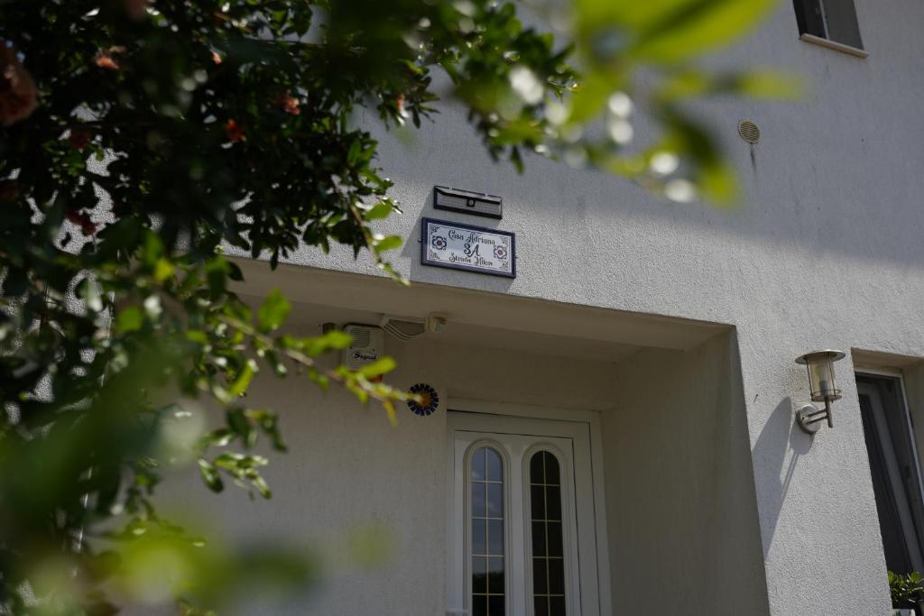 a clock on the front door of a building at Casa Adriana in Eforie Sud