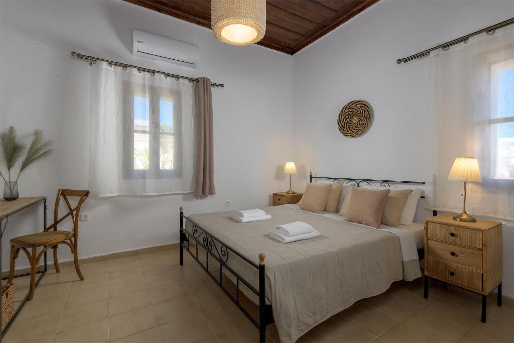 Postel nebo postele na pokoji v ubytování Villa Dorinna