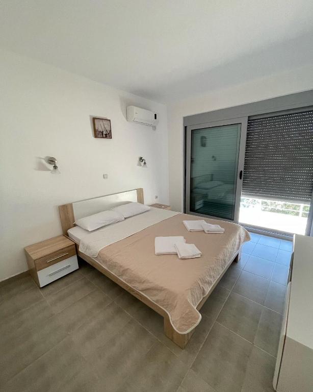 Postel nebo postele na pokoji v ubytování Apartman Ail 2