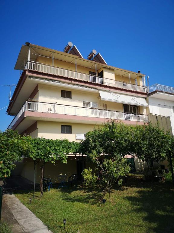 a tall building with a balcony on top of it at Evangelias House! in Stavros