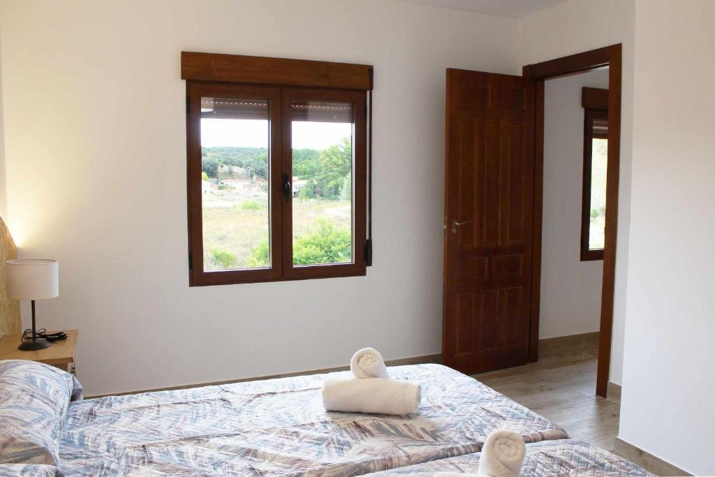 Posteľ alebo postele v izbe v ubytovaní Casas Rurales Tía María