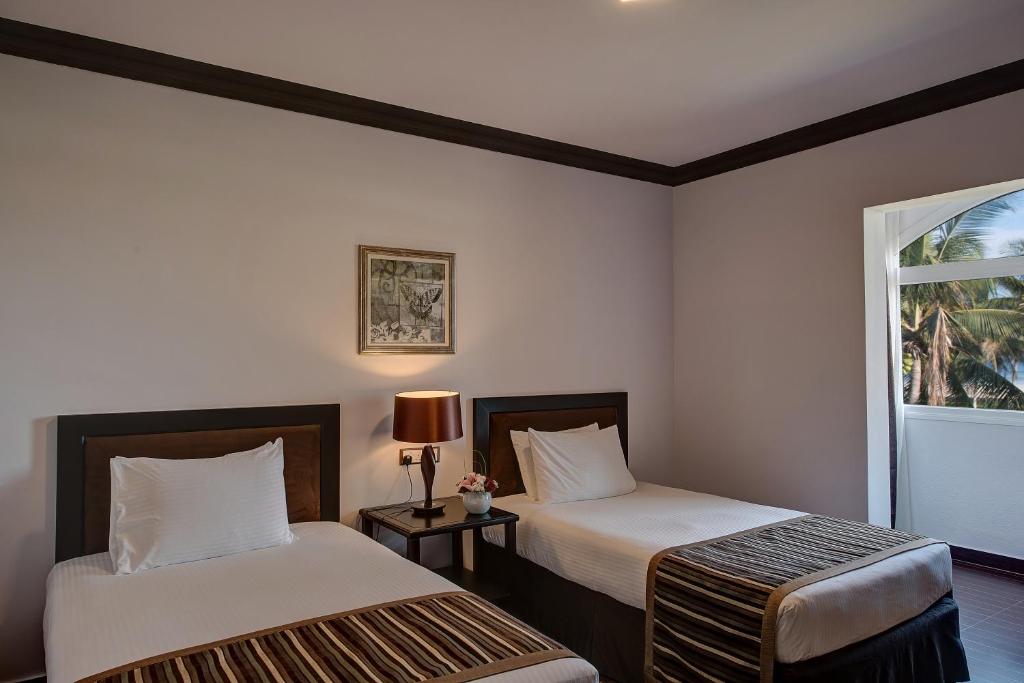 Postel nebo postele na pokoji v ubytování Crowne Plaza Resort Salalah by IHG
