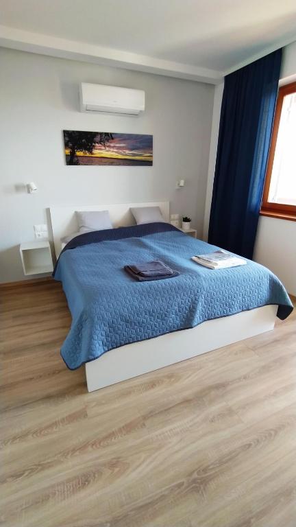 Łóżko lub łóżka w pokoju w obiekcie Lilla Villa