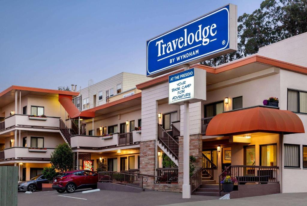a sign for a hotel in front of a building at Travelodge by Wyndham Presidio San Francisco in San Francisco