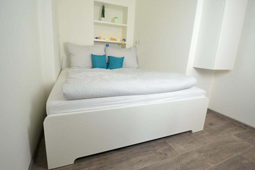 Postel nebo postele na pokoji v ubytování Apartmány Jízdárenská