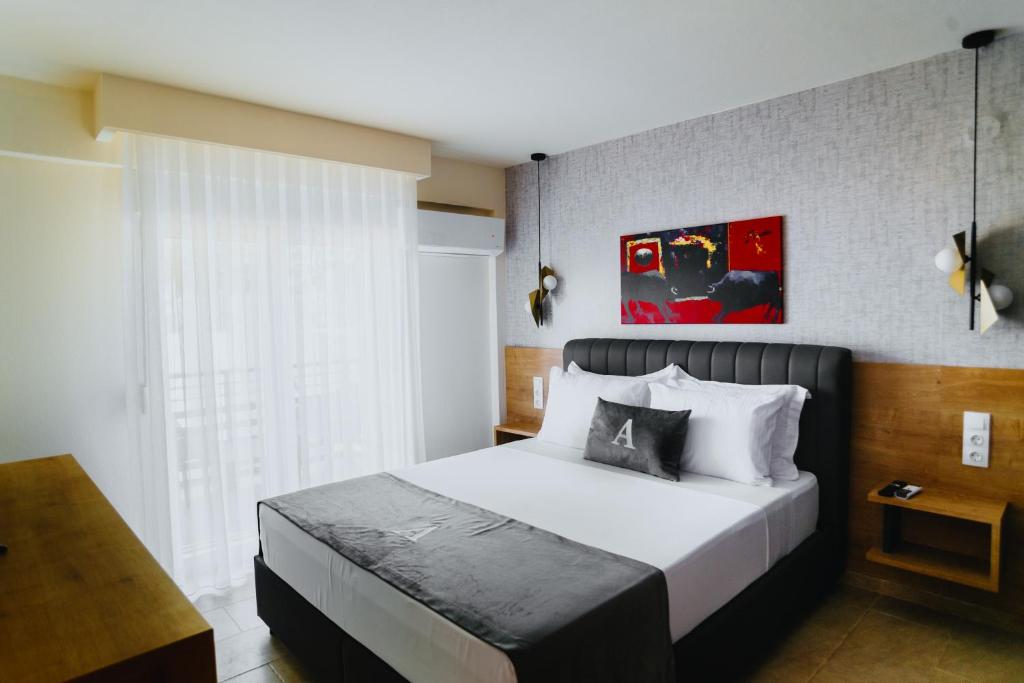 Ένα ή περισσότερα κρεβάτια σε δωμάτιο στο ALEXANDRA Boutique Residence Seaside