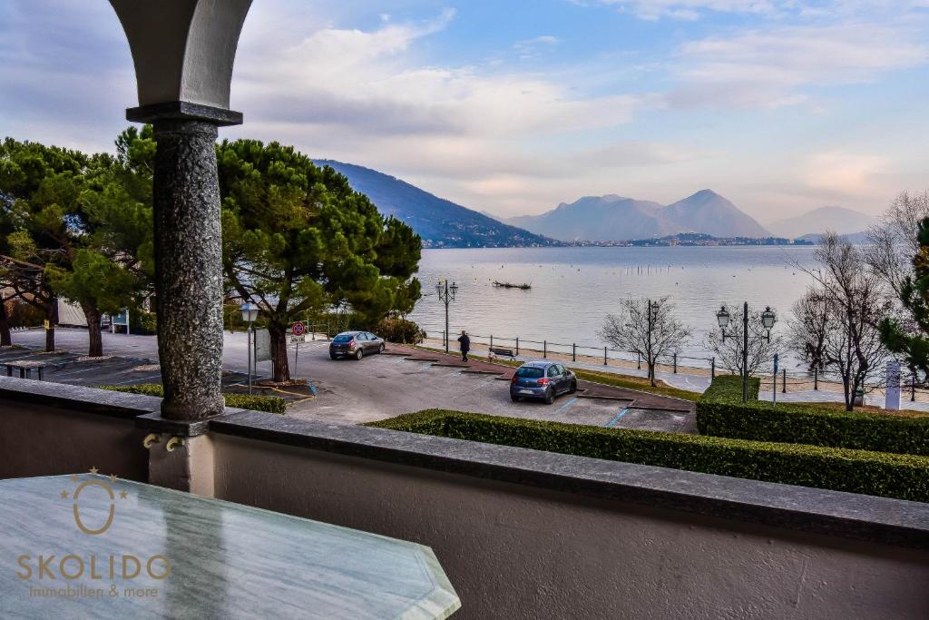 a view of a lake with mountains in the background at Bed, boat and beach in Feriolo direkt am See in Baveno