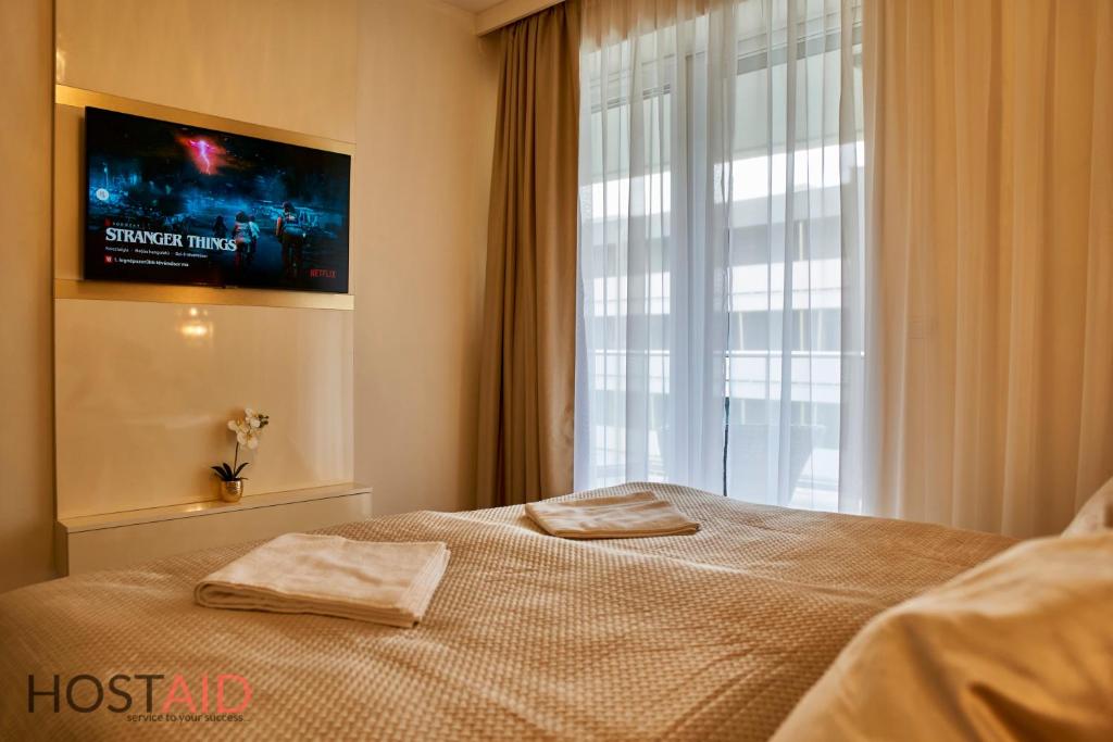Posteľ alebo postele v izbe v ubytovaní Azúr Apartment - hostAID