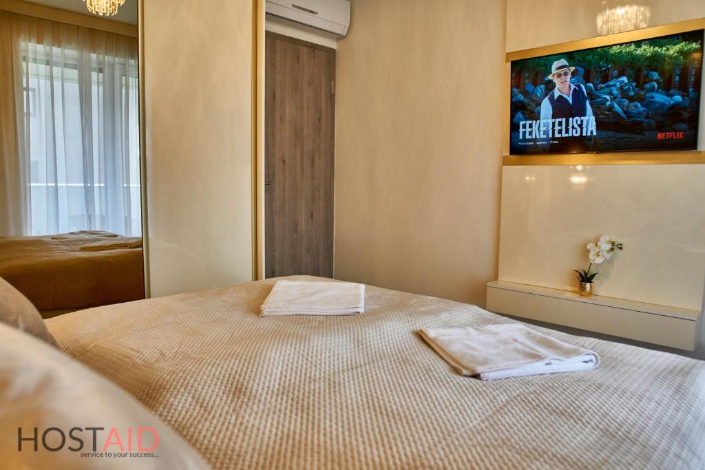 Posteľ alebo postele v izbe v ubytovaní Azúr Apartment - hostAID