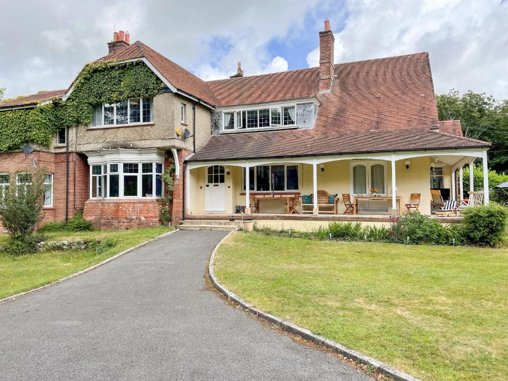 a large brick house with a driveway at Deer Leap House in Dorchester