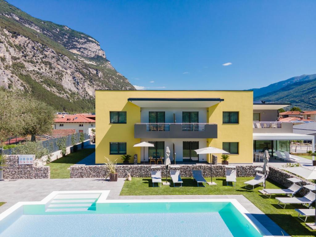 a villa with a swimming pool and a house at Ca' de L'Olif - Holiday Clima Apartments in Dro