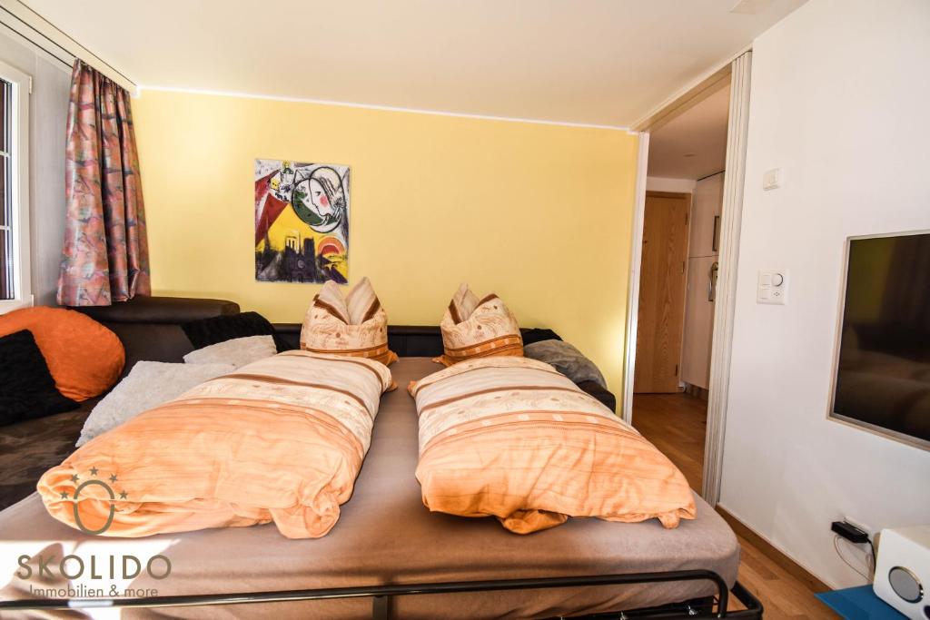Postel nebo postele na pokoji v ubytování Wohnung in Zermatt mit postkarten Matterhornblick