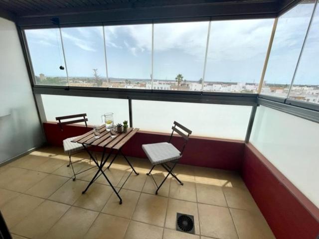 A balcony or terrace at GATU PREMIUM Marismas, terraza, parking, piscina común y aire acc , " Preferente mayores de 25 años y familias "